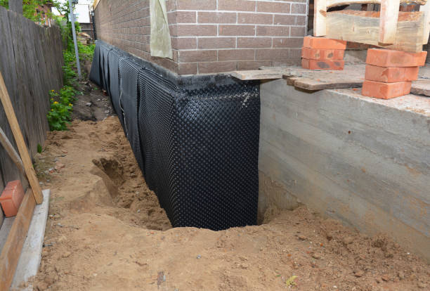 Happy homeowners after waterproofing job in Hutchinson